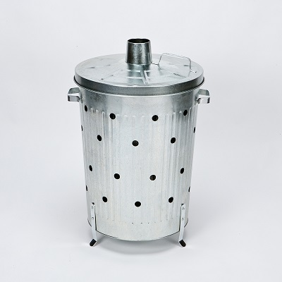 silver galvanised incinerator with breathing holes in the side and small chimney in the lid