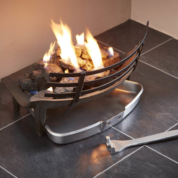 shows a uk wholesale fender and solid fuel set in a fireplace, with yellow flames coming from the coal